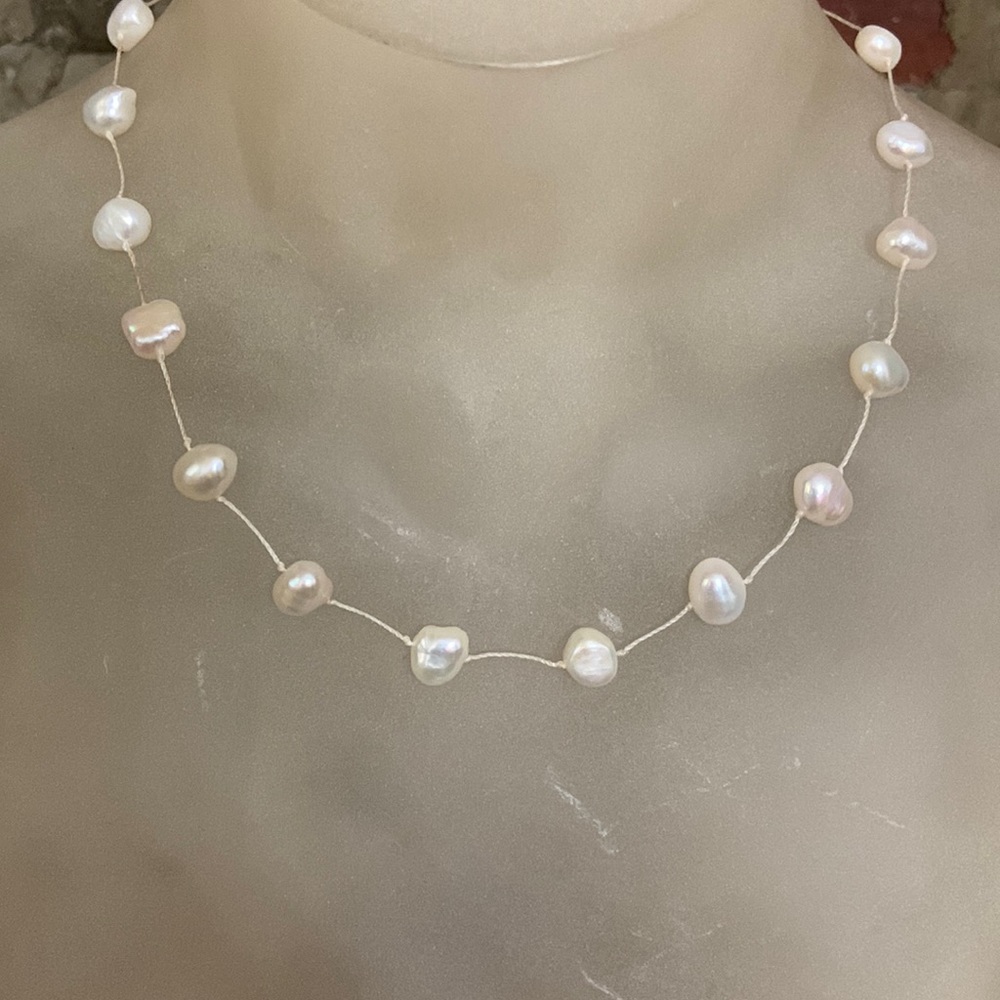 8x7 mm flat Biwa Pearls necklace with lobster clasp.